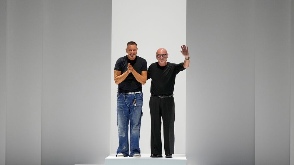 Designers Stefano Gabbana, left, Domenico Dolce accept applause